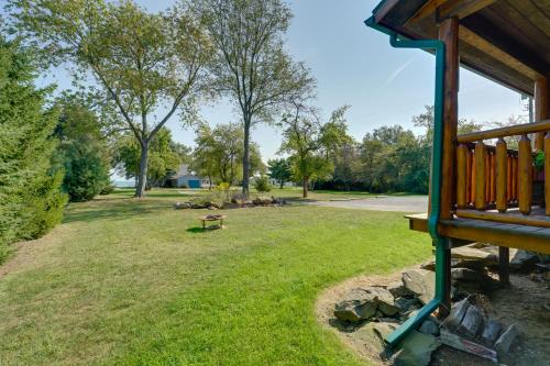 a park with a picnic table and a bench at 1 Mi to Public Beach Port Austin Cabin with Hot Tub in Grind Stone City