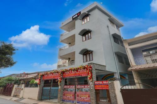a white building with a sign on it at Hotel O Raj in Dānāpur