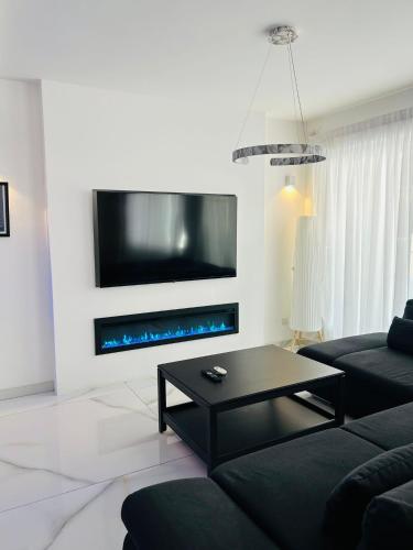 TV a/nebo společenská místnost v ubytování Casa Élan