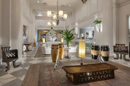 a lobby with drums on display in a building at International House Hotel in New Orleans