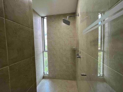 a bathroom with a shower with a glass door at Exclusive apt in Poblado, Central location in Medellín