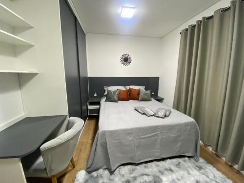 a bedroom with a bed and a table and chairs at Full Studio in Santa Maria in Santa Maria