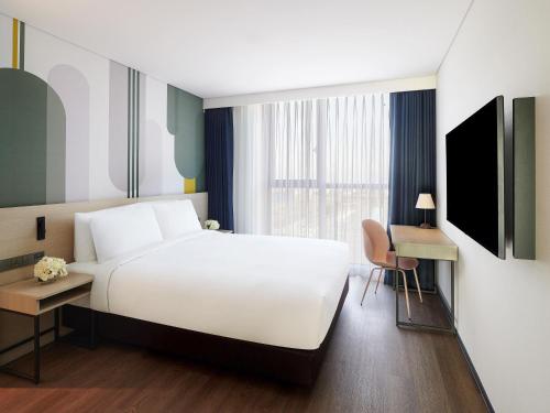 Телевизор и/или развлекательный центр в ibis Styles Ambassador Incheon Airport T2