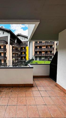 an empty balcony of a building with apartment buildings at Nido Baradello in Le Bratte