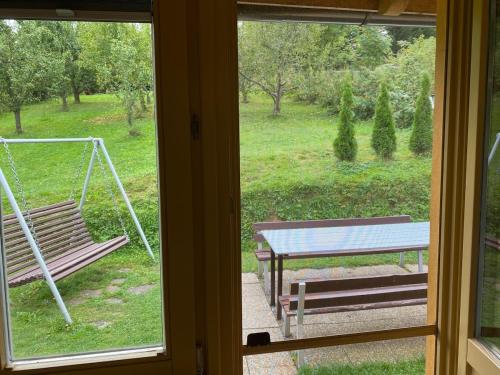 a view of a porch with a swing and a bench at Chata Petra in Oravský Biely Potok