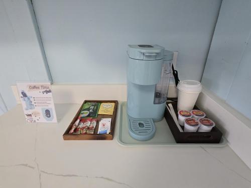 a coffee maker sitting on top of a refrigerator at Richca Chalets Resort in Hope