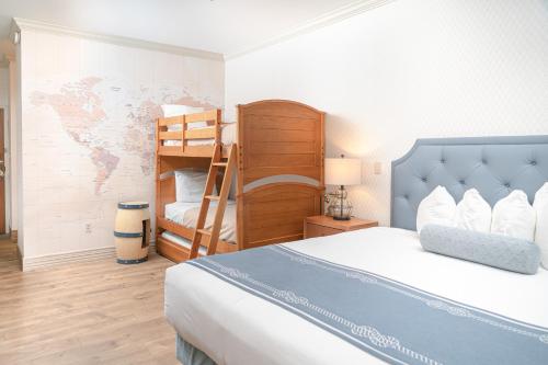 a bedroom with a bed and a bunk bed at Fulton Steamboat Inn in Lancaster