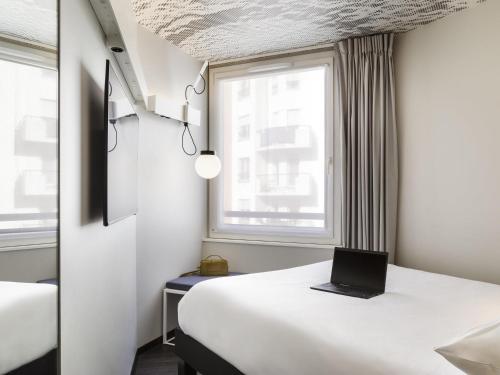 Cama o camas de una habitación en ibis Paris Nation Davout