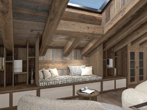a living room with a bench in a room with wooden ceilings at Chalet Méribel 12 pers avec piscine et sauna - FR-1-566-84 in Chandon