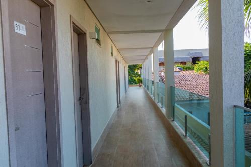 an empty corridor of a building with a balcony at Star Hotel in Jericoacoara
