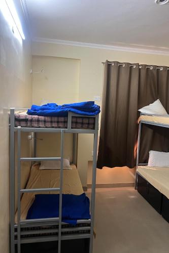 a bunk bed room with two bunk beds in it at Gypsy Monkey in Jaipur