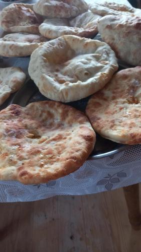 a bunch of pizzas sitting on a table at GuestHouse Ellie- Elisabeth in Adishi