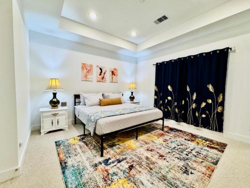a bedroom with a bed and a rug at Colorful Dining Experience in Cozy Getaway in Houston