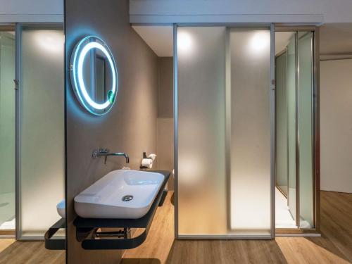 a bathroom with a sink and a mirror at ibis Styles Ljubljana Centre in Ljubljana