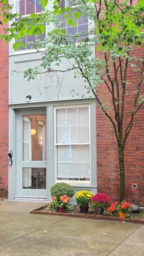 a building with flowers in front of a window at 2BR Apt with Parking Garden View Walk to Waterfront in Providence