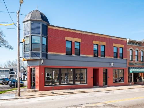 a red brick building with a tower on top of it at Stunning Boho Apt in Ohio City in Cleveland