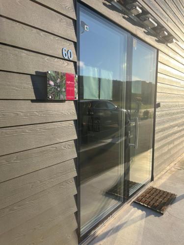 a glass door on the side of a building at Affittacamere Zafferano in Belluno