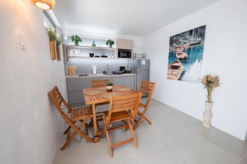 a dining room with a wooden table and chairs at Oceanview Coastal Retreat - 2BR Getaway in Miramar