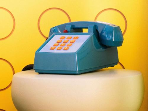 a toy phone sitting on top of a cake at greet hôtel Pont du Gard - Route d'Avignon in Estézargues