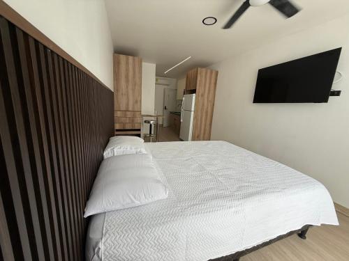 Postel nebo postele na pokoji v ubytování Sabana Urbana