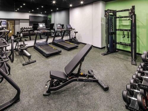 a gym with several treadmills and exercise bikes at ibis Styles Paignton in Paignton
