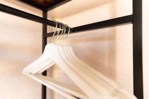a white curtain hanging on a black curtain rod at Hotel Restaurant 't Heerenlogement in Harlingen