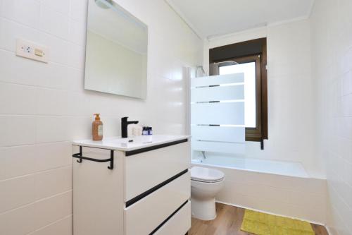 a white bathroom with a sink and a toilet at 210A Casa Linares Amplia casa en Villaviciosa in Cadamancio