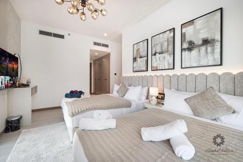 two beds in a hotel room with two beds at Luxury Apartments - Urban Oasis by Missoni - Business Bay - Canal View - 10 Minutes from Dubai Mall Burj Khalifa in Dubai