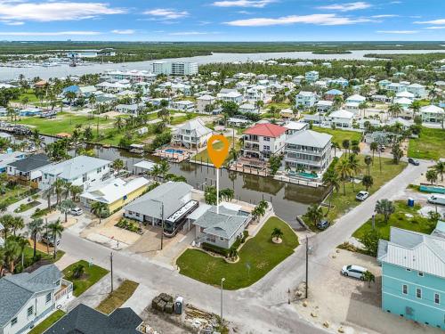 an aerial view of a small town with houses at Boating Enthusiasts, Walk to the Beach, Heated Pool - The Corner cottage - Roelens in Fort Myers Beach