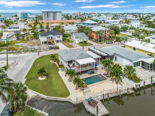 an aerial view of a house on the water at Boating Enthusiasts, Walk to the Beach, Heated Pool - The Corner cottage - Roelens in Fort Myers Beach