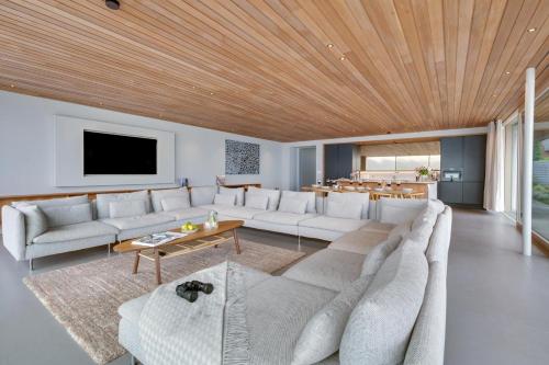 a living room with a large couch and a table at Rock Cove in Cove