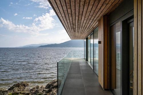 a house with a view of the water at Rock Cove in Cove