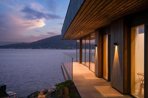 a building with a view of a body of water at Rock Cove in Cove