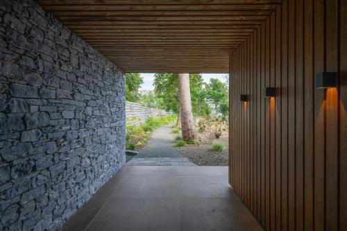 a hallway with a stone wall and a stone walkway at Rock Cove in Cove