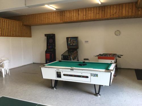a room with a pool table in it at Tolles Appartement mit Klima, Garage für's Auto, Bike's und Skier in Sankt Englmar