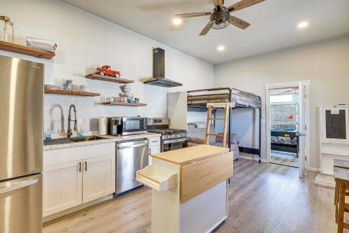 a kitchen with white cabinets and a ceiling fan at Unique Vineyard Studio with Shared Outdoor Oasis! in Vineyard