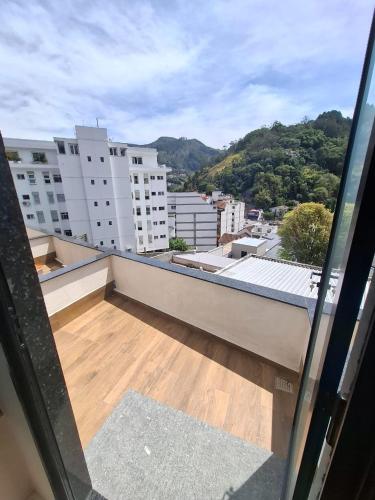 a balcony with a view of a city at Hotel Serra Everest in Nova Friburgo