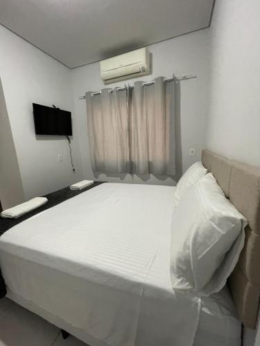 Postel nebo postele na pokoji v ubytování Apartamento em bairro nobre com garagem