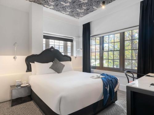 Ένα ή περισσότερα κρεβάτια σε δωμάτιο στο Peppers Gallery Hotel
