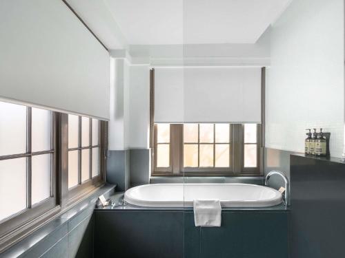 Ένα ή περισσότερα κρεβάτια σε δωμάτιο στο Peppers Gallery Hotel