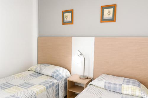Postel nebo postele na pokoji v ubytování Apartamentos Picnic