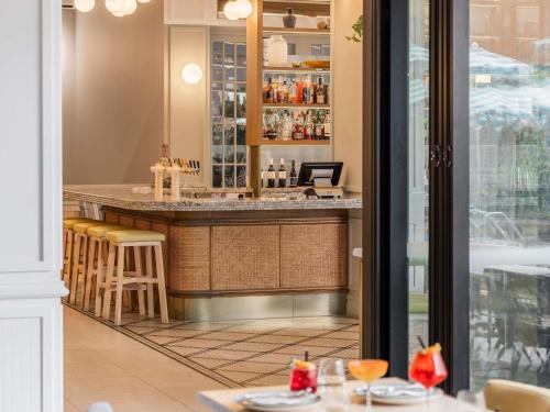 a bar in a restaurant with tables and chairs at The Adnate Perth - Art Series in Perth