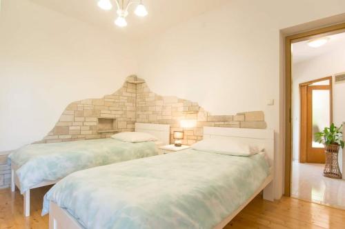 Ένα ή περισσότερα κρεβάτια σε δωμάτιο στο House Salvia