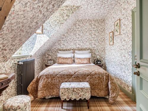 a bedroom with a bed in a attic at Abbaye Des Vaux De Cernay in Cernay-la-Ville
