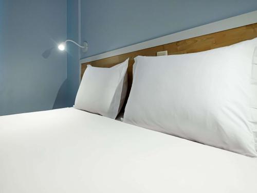 Ένα ή περισσότερα κρεβάτια σε δωμάτιο στο ibis Styles Manaus