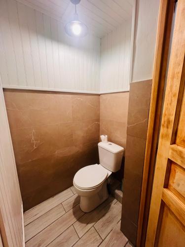 a bathroom with a toilet in a room at L amienoise in Longueau
