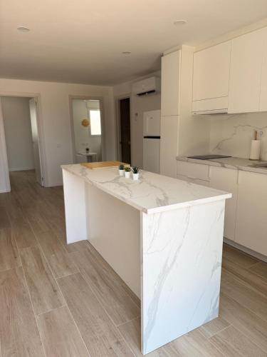 a kitchen with a white counter top in a room at Kilians apartment 4 in Castellón de la Plana