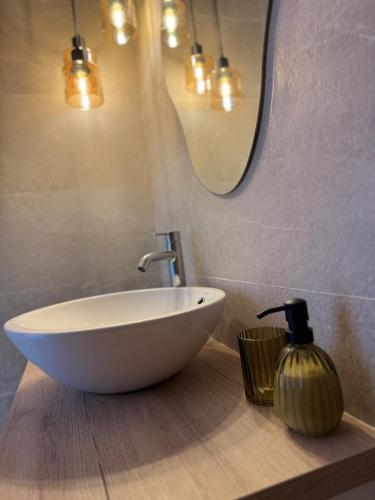 a bathroom with a bowl sink and a mirror at Kilians apartment 4 in Castellón de la Plana