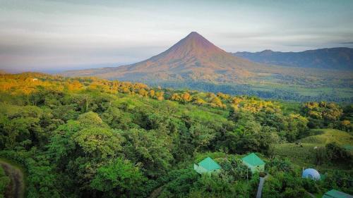 an aerial view of a mountain in the distance with trees at Villas Malu View Domos modernos con vista al Volcán Arenal in El Castillo de La Fortuna