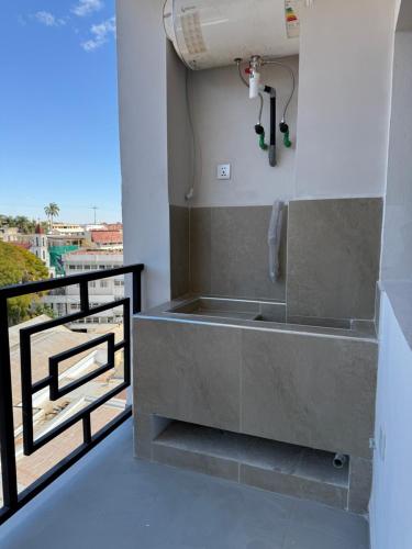 a bathroom with a bath tub on a balcony at HAYAT résidence in Antananarivo